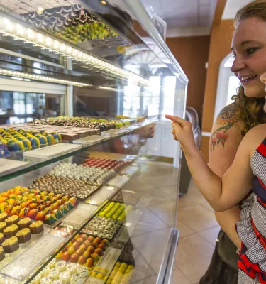 A mother and daughter looking at candies on display at William Dean candy store.