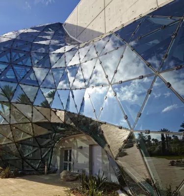 the exterior of the Dali Museum's geodesic dome reflects the clouds and sky