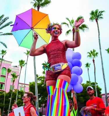 Marchers clad in rainbow clothing pass by the Vinoy during the St. Pete Pride Parade.