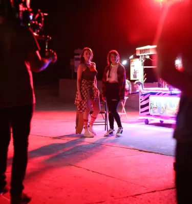 two actors preparing for a night shoot