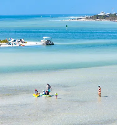 Swimmers, beach and boats at Caladesi and Honeymoon Island State Parks