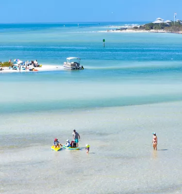 Swimmers, beach and boats at Caladesi and Honeymoon Island State Parks