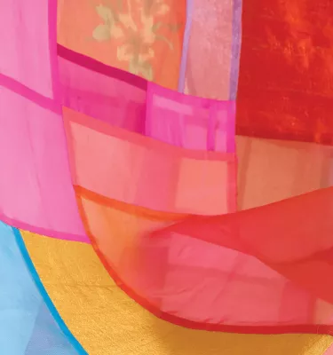 Blue, yellow, pink, orange and red warm tones making up a painting by famous artist Yolanda Sanchez.