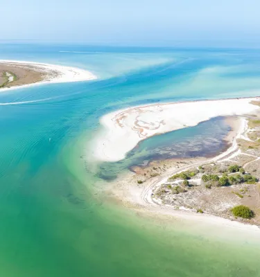 Aerial view of Honeymoon Island State Park with Caladesi Island in the background.