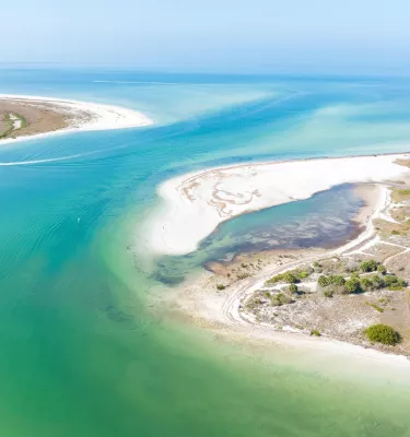 Aerial view of Honeymoon Island State Park with Caladesi Island in the background.