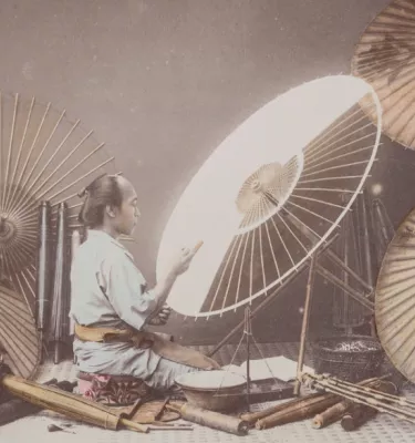 Historic painting of a Japanese man creating an umbrella.