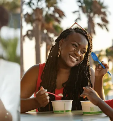 One photo of a girl holding an ice cream cone and smiling. Another photo of a mom and son enjoy ice cream out of cups.