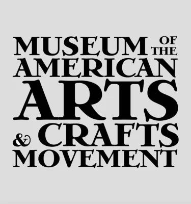 Museum of the American Arts & Crafts Movement signage featuring a grey background and black font.