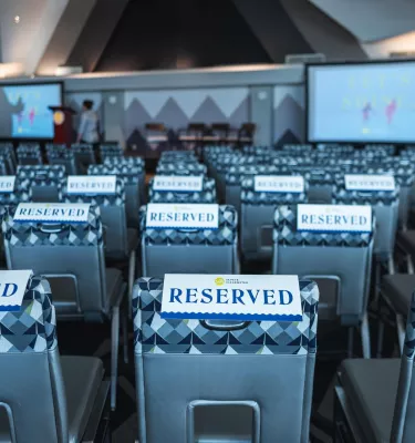 chairs with reserved signs on them