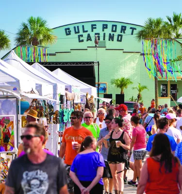 Crowd at GeckoFest with crafts tents and Gulfport Casino.