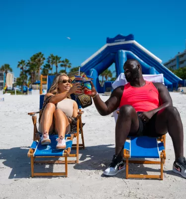 WWE wrestlers in beach chairs with drinks