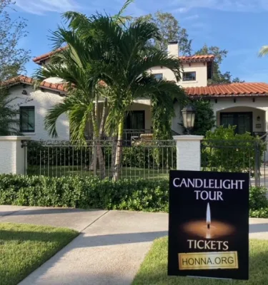 Photo of the front of a Florida home with a black fence during the daytime.