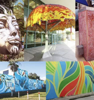 Art walk photo featuring various outside wall murals.