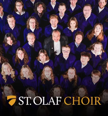 Photo of the St. Olaf Choir featuring a group of 10+ adults in purple robes smiling at the camera.