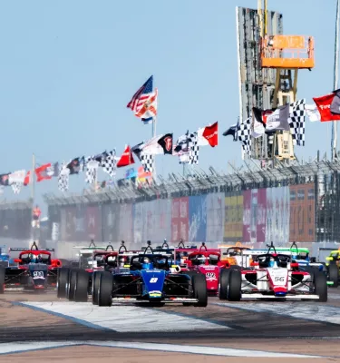 many IndyCar vehicles line up for the beginning of the Firestone Grand Prix of St. Petersburg