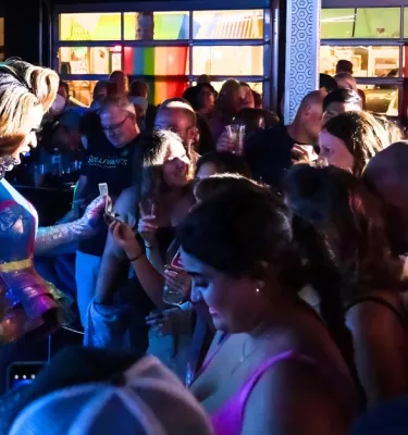 Drag show event at Blur Nightclub featuring a crowd of people.