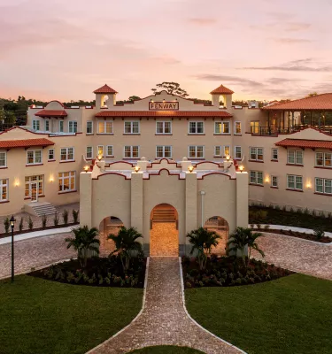 the exterior of the historic Fenway Hotel at dawn