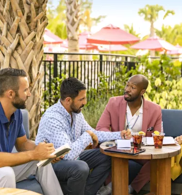 People around a table talking
