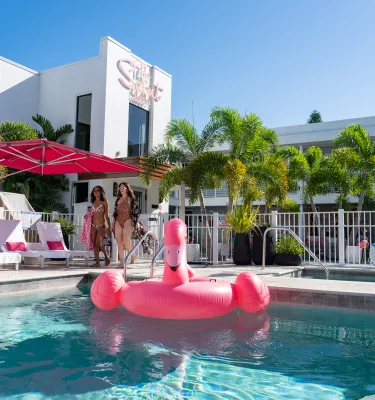 girls walking by the pool