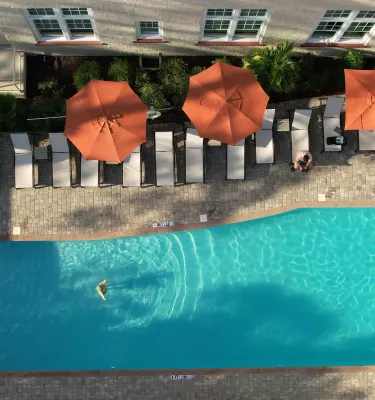 A woman in a pool at the Fenway Hotel