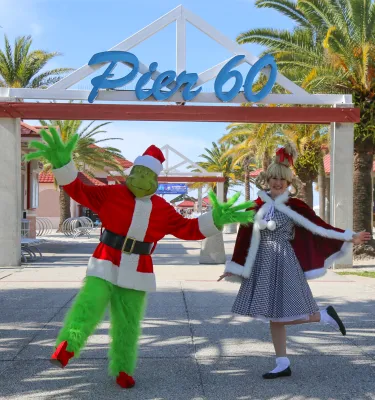 Grinch characters dressed up in front of Pier 60 in Clearwater.