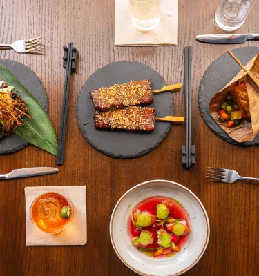 Plates of various Asian fusion dishes