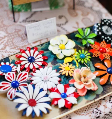 Colorful flower molds on a plate for people to shop.