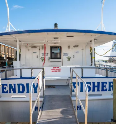 back of boat sitting docked on a pier