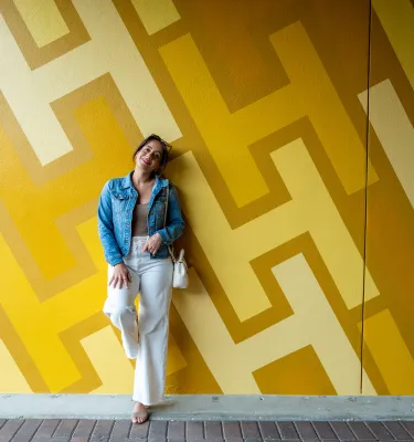 girl in front of wall