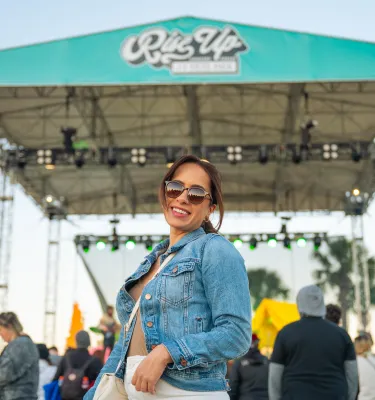 girl in front of concert stage