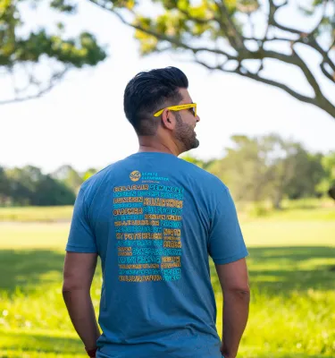 man standing with back turned