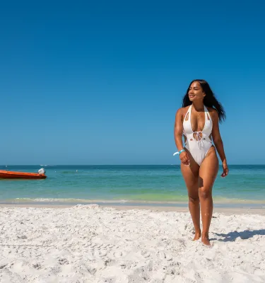 A woman walking on the beach