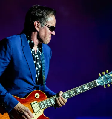 Musician Joe Bonamassa playing his guitar.