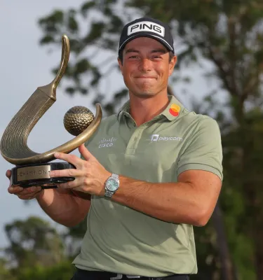 Viktor Hovland, winner of the Valspar Championship 2025, holds his trophy