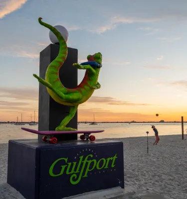 lizard statue and the sunset in the background