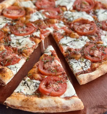 a margarita pizza at Slyce Pizza Bar