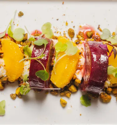 Flavors of Spain Dinner featuring roasted beets on a skewer.
