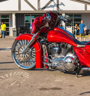 a red motorcycle in front of a building at St. Pete Bikefest
