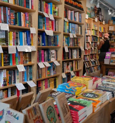 bookshelves with staff recommendations posted at Tombolo Books in St. Pete
