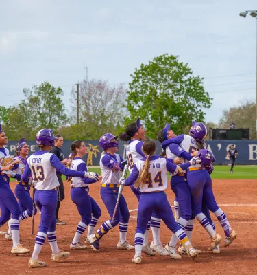 softball players celebrating 