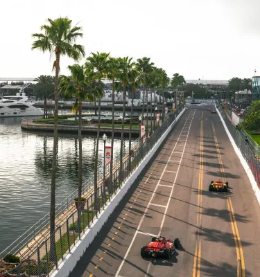 racing cars on the street course next to water at the Firestone Grand Prix