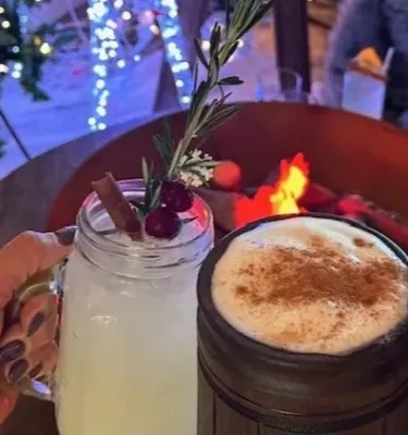 Holiday drinks in front of a cozy fire.
