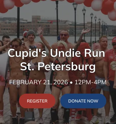 Cupid's Undie Run St. Pete featuring people wearing underwear at a finish line outside.