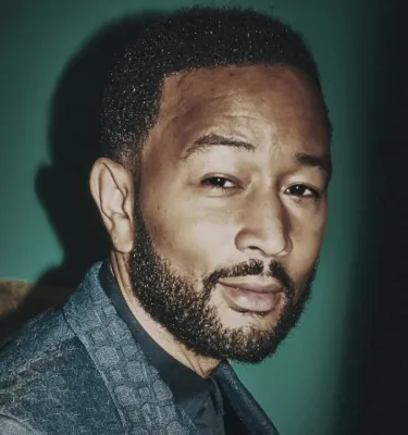 Musician John Legend live in concert event flyer poster.