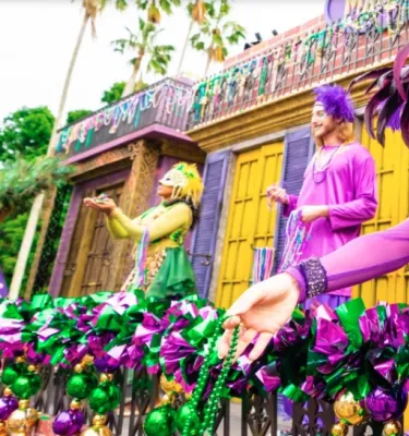 Mardi Gras Busch Gardens Tampa featuring people in costumes passing out beads.