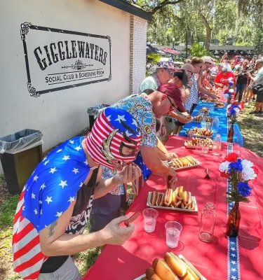 4th of July hot dog eating contest outside.