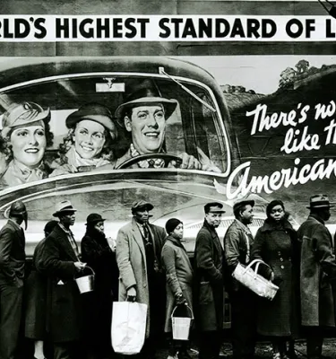 World's Highest Standard of Living art exhibit poster featuring a black and white photo.