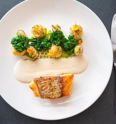 a beautifully design plate of fish and scallops created to look like a flowerpot at Il Ritorno