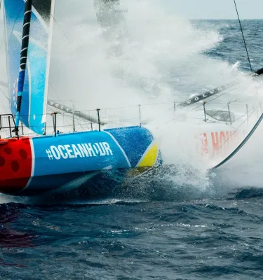 a sailboat splashes through the water during the Ocean Race, coming to St. Pete in May 2027