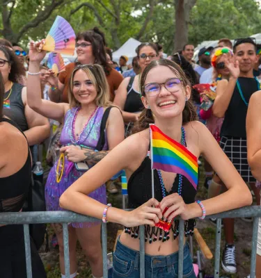 smiling people along the parade route at the St. Pete Pride Parade